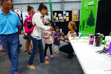 Asking kids to spot the FSC label on items while explaining its meaning to parents