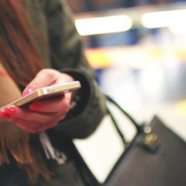 Millennial holding phone